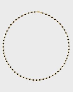 A stunning piece handcrafted with precision in New York City showcasing a series of perfectly round black onyx inlays, each encased in gleaming gold circles. The inlay technique is made in Italy and finished in New York City from our Marquet collection. 14 Karat Yellow Gold Black Onyx 15.5 to 17.5 inches length Handmade in NYC Style # JJ-NBB-236 Black Onyx Jewelry With Polished Beads, Fine Jewelry Onyx With Black Diamonds, Fine Jewelry With Black Diamonds And Onyx, Modern Onyx Jewelry With Black Beads, Luxury Onyx Round Bead Jewelry, Classic Black Jewelry With Round Stone, Modern Jewelry With Round Black Diamonds, Modern Jewelry With Black Diamonds, Modern Black Diamond Round Jewelry