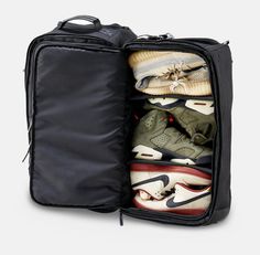 Your weekend travel plans just got a whole lot easier. Designed by a sneakerhead, for a sneakerhead, this weekend travel luggage is ready to go with you on your next adventure. With the sleek black design, collapsible handle, and front-facing laptop pocket, it doesn’t leave much room for an argument besides... “are we driving or flying?” RESHOEVN8R’S luxury design, paired with a traveler's needs in mind, this bag is ready to go. Features: Two wheels for easy, seamless travel Top zipping easy acc Functional Black Travel Bag For Overnight Trips, Practical Black Travel Accessories For Outdoor Activities, Sporty Black Luggage For Overnight Trips, Functional Black Travel Accessories For Outdoor Activities, Practical Black Gym Bag For Overnight Trips, Practical Black Nylon Luggage, Black Waterproof Gym Bag For Travel, Sporty Black Waterproof Travel Bag, Black Nylon Gym Bag For Weekend Trips