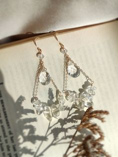 Statement earrings that are delicate and elegant. These are made with natural clear quartz crystals and 14K gold fill. Perfect as boho bridal jewelry or for your special days. * Handmade with natural clear quartz gemstones. Choices of 14K Gold filled & Sterling Silver * Drop length: 6 cm * Widest part is 2 cm * Classy and elegant earrings. A cute treat for yourself and a lovely gift for her ✨ * These earrings won't tarnish. Gold-filled and sterling silver are known for their lasting quality. The Chandelier Jewelry, Boho Bridal Jewelry, Quartz Gemstones, Crystal Chandelier Earrings, Long Dangle Earrings, Handmade Wire Jewelry, Earring Cards, Handmade Wire, Clear Quartz Crystal