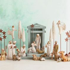 a nativity scene with figurines and trees