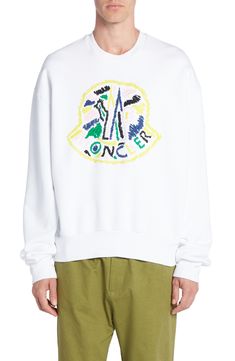 Moncler's signature cockerel logo is carefully stitched onto the center of this crewneck sweatshirt for an unexpected burst of color. Crewneck 100% cotton Dry clean Imported Designer Clothing Casual Sweatshirt With Appliqué Logo For Streetwear, Designer Cotton Sweatshirt For Winter, Casual Winter Tops With Appliqué Logo, Designer Crew Neck Sweater For Streetwear, Designer White Sweatshirt For Winter, Designer Crew Neck Sweatshirt With Logo, Winter Long Sleeve Tops With Appliqué Logo, Long Sleeve Tops With Appliqué Logo For Streetwear, Designer Long Sleeve Cotton Sweatshirt