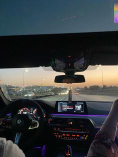 a person driving a car on a highway at night