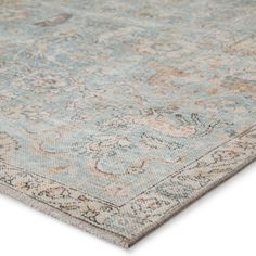 an antique rug with blue and beige colors on the carpet, it is very soft