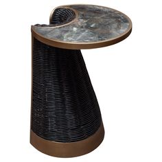 a black wicker table with a marble top and metal base on an isolated white background