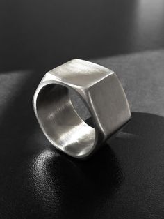 "A unisex industrial hexagonal stainless steel ring made of a real hardware nut. A wide, chunky, geometric band with an edge to it. Perfectly smooth inside. The ring is 0.5\" (1.3 cm) wide. US sizes available for this width are 6 - 10.5. Sizes 11 - 14 are available here: https://www.etsy.com/listing/155354355 Sizes 4.5 - 5.5 are available here: https://www.etsy.com/listing/464852845 Keep in mind that the smaller the ring size (in this particular size range), the thicker the ring sides, and vise Metal Jewelry Making, Metal Jewellery, Flagstaff Az, Metalsmithing Jewelry, Hex Nut, Golden Ring, How To Make Rings, Diy Rings, Stainless Steel Ring