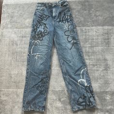 H&M High Waisted Graffiti Jeans Size 26 New Originally $45 Now $25 Cheap Denim Blue Bottoms With Letter Print, Front Printed Jeans, Wriped Jeans, Bad Bunny Senior Jeans, Class Of 2023 Jeans, Cheap Grunge Tops With Graffiti Print, Senior Week Jeans, Senior Week Pants, Homecoming Sprit Pants