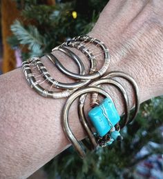 "Welcome to the shop! I rescued this awesome, vintage cuff bracelet a few years ago~ during my travels up North. Then recently, I rescued a vintage Turquoise necklace while traveling through the desert out West. I decided to combine the two, with a custom woven wire wrap ~using gold & antiqued copper coated wire. The hinge on this Bohemian beauty is very strong, and will open to any sized wrist. It's a true cuff at 2\" wide. And it measures 8\" fully closed~ then it will comfortably stretch open Unique Hand Wrapped Cuff Bracelet, Adjustable Unique Style Nickel Free Bangle, Bohemian Hand Wrapped Cuff Bracelet For Jewelry Making, Vintage Metal Wire Wrapped Jewelry, Vintage Wire Wrapped Metal Jewelry, Bohemian Hand Wrapped Metal Bracelets, Unique Wire Wrapped Bracelet, Unique Adjustable Hand Wrapped Bangle, Handmade Turquoise Wearable Art Jewelry