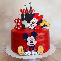 a mickey mouse birthday cake on a table