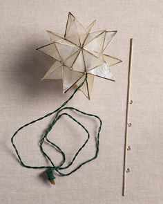 an origami star next to a string