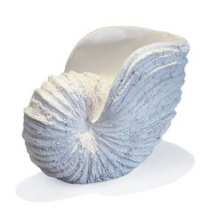 a white chair that is covered in silver fabric and has wings on the back of it