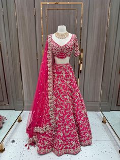 Cerise pink enhanced with pearl, diamonds stone & beads, sequence work highlighted in multi thread floral embroidery flared lehenga. Accomplished with similarly embroidered designer blouse and net dupatta. This pink lehenga is something extraordinary about the blend of ethnic fashion with contemporary details. Fabric: Raw Silk Size: 38/M Occasion: Wedding Ceremony or Reception WASH CARE INSTRUCTIONS - Please Dry clean only when it is applicable. Slight color variation is possible due to digital Flared Lehenga, Pink Lehenga, Cerise Pink, Sequence Work, Designer Blouse, Net Dupatta, Raw Silk, Ethnic Fashion, Diamond Stone