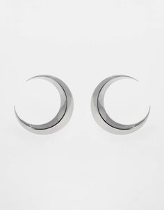 Symmetrical moon-shaped earrings made of sterling silver or sterling silver plated with 24 ct gold. Motif diameter: 24 mm. Decorative engraving on the reverse.We observe the phases of the Moon on Earth trying to solve the mystery of lunar attraction, but one side of this peculiar celestial body is always hidden in the shade of the Sun. Gold Motif, The Phases Of The Moon, Phases Of The Moon, Moon Phases, On Earth, The Moon, Silver Earrings, Silver Plated, Gold Plate