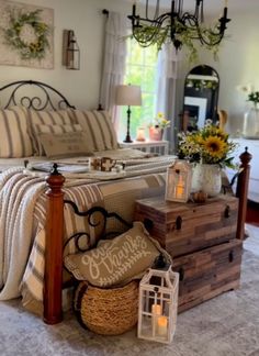 a bed room with a neatly made bed and lots of pillows on top of it