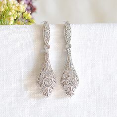 Bridal Earrings, Crystal Wedding Earrings, Art Deco Dangle Drop Earrings, Vintage Style Wedding Bridal Jewelry, Rose Gold Earrings, REGINA by GlamorousBijoux on Etsy https://www.etsy.com/listing/578725360/bridal-earrings-crystal-wedding-earrings Silver Diamond Earrings With Intricate Design For Wedding, Elegant Drop Diamond Earrings For Wedding, White Pierced Diamond Wedding Earrings, White Pierced Diamond Earrings For Wedding, Ornate Wedding Diamond Drop Earrings, Wedding Dangle Diamond Earrings, White Gold Teardrop Chandelier Earrings For Wedding, Vintage Sterling Silver Chandelier Earrings For Wedding, Wedding Bridal Earrings In White Gold For Pierced Ears