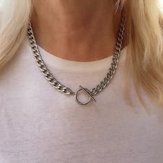 "This unisex silver necklace is about to be your everyday go-to for layering or as a solo statement piece -- it's all up to you. A stainless steel curb chain connected with a t-bar toggle, the perfect statement chain choker necklace that will have everyone talking. Details * WATERPROOF * Material: silver plated stainless steel chain 13mm. * Chain Style: Curb * Chain thickness: 3mm * Different Chain lengths (from 16\" to 20\" inches long including the clasp). Choose the length from the dropdown m Luxury Chain Link Toggle Necklace For Formal Events, Curb Chain Necklace For Gifts, Cheap Sterling Silver Curb Chain Necklace, Silver Toggle Choker Necklace With Lobster Clasp, Silver Toggle Clasp Chain Choker, Silver Choker Chain Necklace With Toggle Clasp, Silver Chain Link Necklace With Toggle Clasp, Silver Toggle Chain Choker Necklace, Everyday Metal Toggle Necklace Choker