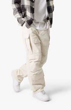 The ultrabaggy fit of these nonstretch cotton pants lets you move with ease all day long, while the cargo pockets keep all your essentials close at hand. 32 1/2" inseam; 9 1/2" leg opening Zip fly with button closure Front scoop pockets; cargo flap-patch pockets; back patch pockets 100% cotton Machine wash, tumble dry Imported Cream Pants Outfit, Cargo Pants Outfit Men, Cargo Pants Baggy, Pants Outfit Men, 140 Lbs, Cotton Cargo Pants, Cream Pants, Baggy Cargo Pants, Cargo Pants Outfit