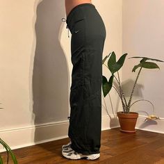 Deadstock Vintage Nike joggers / parachute pants in dark green . Come brand new with tags on. Size: Medium / UK12 (modelled size) Model is typically uk8 but wearing a 12 for a more loose/oversized fit - have drawstrings on waist to fit smaller sizes xx Instant buy is on! Available ✅ Instant buy is on! Measurements: Inside leg 31.5" Model is 5'6 and is typically size UK8  We ship internationally: message us for international postage prices before purchasing.  Items are dispatched next day (mon - sat).  Vintage Deadstock condition with tags still on.       Nike tracksuit bottoms  Nike cargos Green Nylon Parachute Pants Athleisure, Green Nylon Parachute Pants For Athleisure, Green Nylon Sporty Parachute Pants, Green Athleisure Parachute Pants With Pockets, Green Parachute Pants With Elastic Waistband For Sports, Casual Green Nylon Pants, Green Athleisure Cargo Pants For Sports, Sporty Green Full-length Parachute Pants, Green Relaxed Fit Cargo Pants For Sports