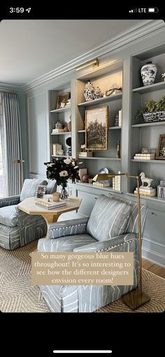 the living room is decorated in blue and gray tones, with an interesting pattern on the walls