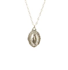 Virgin Mary medallion necklace, miraculous medal necklace, catholic, protection, a sterling silver mother of god on a sterling silver chain This sterling silver Virgin Mary hangs from a sterling silver chain in the length of your choice. This pendant is also available in 14k gold vermeil on a 14k gold filled chain. Charm measurements: 12mmx10mm. Looking for other charm necklaces? https://www.etsy.com/shop/BubuRuby?section_id=12318467 More crystals and healers? http://www.etsy.com/shop/BubuRuby?s Oval Miraculous Medal Necklace As Gift, Silver Necklace With Miraculous Medal For Gift, Silver Necklace With Miraculous Medal As Gift, Vintage Silver Necklace With Miraculous Medal, Miraculous Medal Round Pendant Necklace As Gift, Miraculous Medal Round Pendant Necklace For Gift, Sterling Silver Miraculous Medal Necklace As Gift, Silver Miraculous Medal Pendant, Silver Pendant With Miraculous Medal