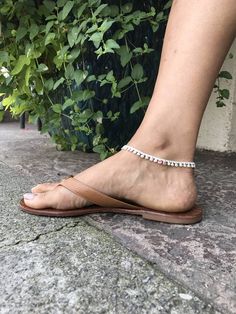 Each of these beautiful handmade anklets are limited stock due to unique design. Check out shop for other designs.  ITEM DETAILS: - Pure sterling silver - Water-resistant  - Handmade from India - Can be purchased as pair or single anklet - Compliments any attire, shoe style and skin tone PRICING: Single: $25 Pair: $45 Silver Barefoot Sandals With Ankle Strap, Silver Ankle Strap Barefoot Sandals As Gift, Traditional White Anklets With Silver Beads, White Ankle Strap Bracelet For Gifts, White Ankle Strap Anklets As Gift, Handmade Silver Anklets For Summer, Traditional White Adjustable Anklets, White Bohemian Toe Ring Anklets, Bohemian White Toe Ring Anklets