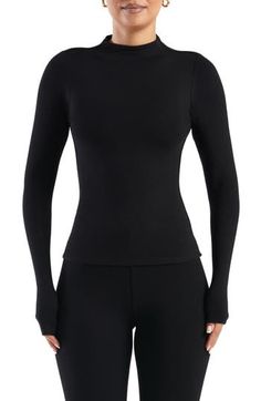 Buttery-soft fabric lends an indulgent feel to this stretchy, long-sleeve top crowned with a mock neck. 21 1/2" length (size Medium) Mock neck Long sleeves Partially lined 87% rayon, 13% spandex Hand wash, line dry Made in the USA Naked Wardrobe, Mock Neck Top, Soft Fabric, Mock Neck, Soft Fabrics, Long Sleeve Tops, Sleeve Top, Top Blouse, Hand Wash