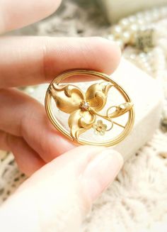 "Beautiful Antique French 18k Gold and Seed Pearl Floral Art Nouveau c1900s Oval Brooch, Solid Gold Edwardian Pin, Gift for Woman or Man Size - approx. 28,6x23,4mm / 1,12\" x 0,92\" Weight -  1,87g Brooch is in a perfect antique condition, very high quality, delicate and beautifully detailed, with floral motif in an oval frame. Created in France circa the second half of the 19th century to 1910s, in a style between edwardian and art nouveau, very collectible piece! Made of a 18k solid yellow gold, really dainty and sophisticated, thin and delicate, with lightly green-gold accent in a little flower and a natural seed pearl in the center. Very elegant, rare unique piece!✨  If you are looking for a beautiful gift for antique loving woman or man, this one will be perfect! 🧡 Can be also a beau Art Nouveau Accents, Antique Gold Brooches With Rose Cut Diamonds, Ornate Gold Brooch With Rose Cut Diamonds, Ornate Gold Brooches With Rose Cut Diamonds, Antique Yellow Gold Brooches With Intricate Design, Ornate Engraved Yellow Gold Brooches, Antique Yellow Gold Filigree Brooches, Antique Yellow Gold Wedding Brooches, Victorian Gold Engraved Brooches