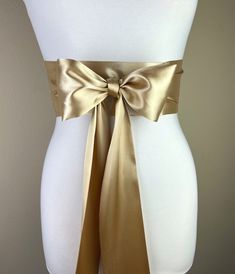 "Gold Sash, Gold Satin Sash  Light Gold Wedding Dress Sash Belt  Satin Sash, Gold Bridal Sash  Obi Sash Belt in Gold  Satin Swank  Make this Satin Swank® reversible waist sash the perfect finishing touch for your wedding, bridesmaid, or special occasion dress, or just the right piece to add instant polish to your dress or top.  This extra long version is 3.5 inches wide, 120 inches long, and will wrap around most waist sizes two times with a generous length remaining to tie in a bow or a simple Wedding Sash With Tie Back, Elegant Satin Sash With Tie Back, Satin Sashes For Bridesmaids, Fitted Bow Sash For Bridesmaid, Wedding Bridal Belt With Sashes In Satin, Wedding Satin Tie Back Sash, Elegant Fitted Sashes With Tie Back, Fitted Bridesmaid Sash With Bow, Elegant Fitted Sash With Tie Back