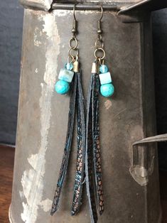 Tassel Leather Earring with Turquoise Beading Bohemian Turquoise Tassel Earrings, Turquoise Tassel Earrings With Dangling Beads, Leather Tassel Earrings, Feather Fans, Leather Earring, Feather Fan, Leather Tassel, Turquoise Beads, Leather Earrings