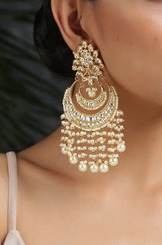 This beautifully handcrafted earrings is set in silver and copper alloy and plated with 22k gold. DETAILS Length - 7.5 cm Closure - Push Back STYLE TIP We love teaming this with classy chiffon sarees or zari silk sarees. Also looks best when worn with your royal whites, off whites and gold. We recommend styling with pastel solids or floral dresses in peachy pink, pistachio green and pastel blue too. Perfect for them Red weddings or banarasi sarees. This is a perfect solution to your pastel weddi Chandbali Earrings Gold, Aesthetic Saree, Desi Jewellery, Kundan Chandbali, Red Weddings, Desi Jewelry, Aesthetic Jewellery, Pastel Jewelry, Indian Wedding Jewelry Sets