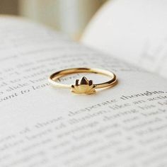 Fulfilled by our friends at Tiny Rituals Say yes to your inner Siddhartha as you let the Padma peel back her petals to bloom into being. This Lotus Gold Ring is a delicate daily reminder that we all have the power to reach peace and perfect enlightenment. “I serve myself the daily reminder to rise above pure and strong regardless of what surrounds me”. Description One of Buddhism’s most prominent symbols, this glorious golden ring showcases the lotus posture in the center of her gleaming band. F Lotus Flower Ring Gold, Lotus Gold Ring, Lotus Ring Gold, Lotus Engagement Ring, Buddhism Symbols, Small Earrings Gold, Lotus Flower Ring, Lotus Ring, Lotus Flower Design