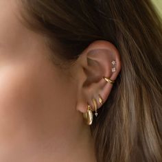 Add a little more style to your ear stack with these adorable knot huggies.| Lead and Nickel free.Sold as a PAIR Gold Vermeil (Thick layer of Gold plated over Sterling Silver) Width 3mm(0.12in) Inside Diameter 8.5mm(0.3in) Hinge closure #E468-8G Good Ear Piercing Combinations, Classy Ear Stack, 2 Earrings In One Ear Gold, Gold Stack Earrings, Classy Earrings Everyday, Ear Piercing Ideas For Small Ears, Stackable Earring Ideas, Ear Piercings Small Ears, Ear Stack Ideas