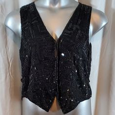 Black Silk Sequin Vest/Shirt Size Petite Medium 100% Silk From Smoke Free Pet Free Home Condition Is Pre-Owned Excellent Black Tops For Christmas Party, Festive Black V-neck Top, Black Party Tops For Christmas, Black Christmas Party Tops, Black Christmas Party Top, Fitted Black Christmas Top, Fitted Black Top For Christmas, Fitted Sleeveless Top For Holiday, Black Top For Festive Holiday Occasions