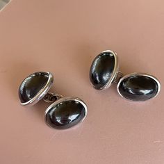 Beautiful bezel set natural hermatite cabochons in solid 18K white gold. Marked 18K with a designer mark Each bezel measures 16x10mm 17.1g Vintage Polished Cabochons For Formal Use, Classic Silver Polished Cabochons, Classic Silver Cabochons With Polished Finish, Elegant White Gold Cabochons For Formal Occasions, Elegant Silver Cabochons For Gifts, Luxury Silver Polished Cabochons, Silver Round Cabochons For Formal Use, Round Silver Cabochons For Formal Use, Classic Silver Oval Cabochons