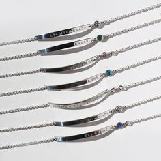 "Our signature personalized, sterling silver birthstone bracelet, features a sparkling birthstone accent, and is the perfect mom, bridesmaid or wedding bracelet. Engrave the front of the nameplate with a name, date, a heart or initials for a stunningly simple piece. Wear as an expression of all that you love.... We use a heavy gauge metal to produce all our nameplates, with our excellent workmanship, we create a high quality look. Each letter is hand stamped using metal letter punches, not machi Classic Silver Bracelets With Birthstone, Classic Silver Birthstone Bracelets, Classic Silver Bracelet With Birthstone, Classic Sterling Silver Birthstone Bracelets, Sterling Silver Birthstone Bracelet For Anniversary, Elegant Hand Stamped Sterling Silver Name Bracelet, Anniversary Sterling Silver Bracelet With Birthstone, Silver Dainty Name Bracelet With Birthstone, Dainty Silver Name Bracelet With Birthstone