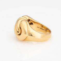 This is part of Chairish’s Fine Jewelry assortment.  Stylish Bulgari ring crafted in 18 karat yellow gold (circa early 2000s).    The design of the Doppio Cuore ring is inspired by the symbol of two intertwined hearts, representing love, connection and affection. Bulgari's designers drew inspiration from classical motifs while infusing a modern touch, characteristic of Bulgari's design aesthetic. The wide band is designed in an east to west position and is great worn alone as a statement piece or stacked. The ring weighs 18.8 grams and has a hefty feel on the hand. The low rise band (7mm - 0.27 inches) sits comfortably on the finger.     The ring is in very good condition and was lightly cleaned and polished.   Particulars:  Weight: 18.8 grams  Stones:    Size & Measurements: The ring is a Formal Modernist 14k Gold Ring, Modernist 14k Gold Ring For Formal Occasions, Modernist Hallmarked Wedding Rings, Modernist Yellow Gold Rings For Formal Occasions, Modernist Yellow Gold Wedding Jewelry, Modernist Yellow Gold Jewelry For Wedding, Modernist 14k Gold Formal Ring, Modernist Gold Wedding Rings, Modernist 14k Gold Hallmarked Rings