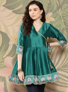 *Teal and golden printed tunic ,has a v-neck, three-quarter sleeves, tie-ups detail,   *Fabric:-  Silk Blend  *Wash Care:-  Hand Wash *Package Contains:- Only One Kurta AVAILABLE IN 7 SIZES THEY ARE IN FOLLOWING MEASUREMENTS IN INCHES:- XXS:- Bust-32/To Fit Waist-26/Length-32/Hip-34 XS:- Bust-34/To Fit Waist-28/Length-32/Hip-36 S:- Bust-36/To Fit Waist-30/Length-32/Hip-38 M:- Bust-38/To Fit Waist-32/Length-32/Hip-40 L:- Bust-40/To Fit Waist-34/Length-32/Hip-42 XL:- Bust-42/To Fit Waist-36/Length-32/Hip-44 XXL:- Bust-44/To Fit Waist-38/Length-32/Hip-46 NOTE ►► Please feel free to contact us for any further questions.CUSTOMISATION We do customisation ️ ►► Please feel free to contact us for any further questions. Traditional Green V-neck Tunic, Festive V-neck Kurta For Party, Eid Anarkali V-neck Dress, Festive Bohemian V-neck Set, Festive Green V-neck Sets, Fitted V-neck Kurta For Navratri, Bollywood Style V-neck Navratri Dress, Fitted V-neck Kurta For Diwali, Bohemian V-neck Sets With Dupatta