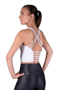 No wardrobe is complete without a white crop top like this stunning piece. Designed with active women in mind, our Finesse bra is the mother of all sporty yet cute crop tops. Its moisture-wicking fabric makes this bra the perfect gym companion, while its delicate back detail will look excellent teamed with relaxed evening wear. Product details - Wear it as a crop top or a medium support sports bra - Removable pads - 4-way stretch design - High neck design adds coverage - Flattering back strap de Athleisure Strappy Sports Bra With Built-in Bra, Strappy Sports Bra With Built-in Bra, Compressive Cross Back Sports Bra With Built-in Bra, T-back Sports Bra With Straps For Workout, Cross Back Sports Bra With Built-in Bra For Training, Sports Bra With Strappy Back And Built-in Bra, Athleisure Sports Bra With Built-in Padding, T-back, Sports Bra With Built-in Padding For Light Exercise, High Stretch Crop Top With Built-in Padding For Workout