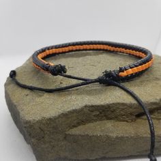 If you like orange and black, then this simple bracelet is perfect for you to add to your collection. The bracelet is adjustable via a sliding knot. Product Information Material: PU leather Clasp Type: rope (sliding knot) Adjustable: 6.5 inches to 8 inches Adjustable Orange Beaded Bracelets For Everyday, Handmade Orange Casual Friendship Bracelet, Casual Handmade Orange Friendship Bracelets, Adjustable Sliding Knot Friendship Bangle, Adjustable Casual Braided Bangle Bracelets, Casual Handmade Orange Friendship Bracelet, Casual Adjustable Braided Bangle Bracelet, Handmade Adjustable Orange Bracelets, Adjustable Handmade Orange Bracelets