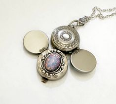 Discover the elegance of yesteryear with this enchanting vintage-inspired pink opal locket necklace. A captivating accessory that combines the timeless allure of a classic four-photo locket with the unique beauty of a shimmering pink opal. Perfect for safeguarding cherished memories, this locket opens to reveal spaces for four treasured photos, making it a personal and heartfelt gift for any occasion.  This lovely necklace is made using a vintage glass fire opal.  The opal is high quality and fe Handmade Vintage Locket Necklace In Antique Silver, Handmade Adjustable Vintage Locket Necklace, Personalized Vintage Pink Jewelry, Handmade Vintage Locket Necklace Adjustable, Handmade Antique Silver Vintage Locket Necklace, Opal Locket Necklace, Handmade Vintage Adjustable Locket Necklace, Opal Locket, Vintage Nickel-free Metal Locket Necklace