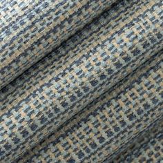 a close up shot of a blue and beige tweed fabric