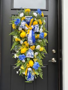 a blue and yellow wreath on the front door