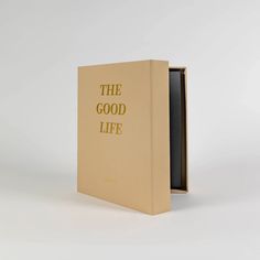 an open book with the words'the good life'written in gold on it