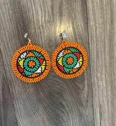 These gorgeous traditional beaded Zulu disc earrings are a gorgeous statement piece must haves.  Please note each piece is handmade and slight variations may occur. Artisan Multicolor Round Beaded Earrings, Traditional Beaded Hoop Earrings, Artisan Earrings With Dangling Beads, Traditional Beaded Earrings With Round Beads, Traditional Beaded Dangle Hoop Earrings, Traditional Multicolor Earrings With Large Beads, Artisan Beaded Earrings For Festive Occasions, Traditional Round Bead Earrings For Festivals, Festive Beaded Round Earrings