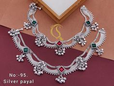 Description :- Bridal Wear Anklet | Payal | Indian Jewellery | Well Made | Wedding Gift Silver Payal/ Panjeb/ Pakistani Jewelry/ Bollywood Jewelry Gift yourself a royal look with this perfectly crafted payal from Manalisstudio. Crafted with high quality Silver Plated, it is impressive in design. The green enamel artwork adds perfect texture to the design. Perfect for weddings and festivities, this antique necklace set should be put on with your favorite sari or lehenga. 100% Satisfaction. Long L Silver Anklets Indian Bridal, Cheap Wedding Bracelets For Navratri, Cheap Silver Jewelry For Puja, Cheap Adjustable Jewelry For Puja, Cheap Women's Chandbalis For Wedding, Festive Bollywood Style Bracelets, Cheap Traditional Bracelets For Festive Occasions, Cheap Chandbalis For Women Suitable For Weddings, Cheap Traditional Chandbalis For Women