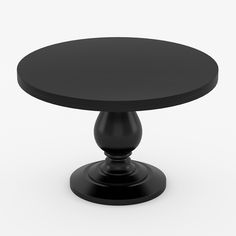 a black round table sitting on top of a white floor