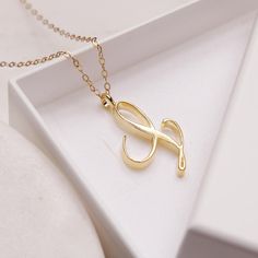 "L Initial Necklace - Cursive \"L\" initial gold pendant necklace - Monogram necklace for women - Personalized gold Initial necklace for her Dainty \"L\" initial. Perfect every day necklace. Lovely gift for your self, sister, bridesmaids, new mom. Convo me if you would like to customize the length of the chain. The possibilities are endless. Pendant: Base metal is brass and 16K gold plated. Chain is 18 inches, 14k gold filled. (if you would like a longer or shorter chain, please contact us to cu L Initial Necklace, Cursive L, Every Day Necklace, Heart Shaped Diamond Pendant, L Initial, Pave Heart Necklace, Sideways Initial Necklace, Gold Initial Necklace, Sparkly Necklace