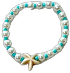 a starfish bracelet with white pearls and turquoise beads on a white background for an ocean theme