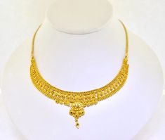 22k Gold 15" Ornate Handmade Necklace. 20.8grams Add a touch of elegance to your outfit with this stunning 22k gold necklace. Crafted by hand, this necklace features an ornate design that is sure to catch the eye. The necklace is 15 inches in length and made with yellow gold, giving it a luxurious look. The necklace is perfect for any occasion and would make a great addition to any jewelry collection. The Estate brand is known for its high-quality jewelry, and this necklace is no exception. Whether you're looking for a special gift or just want to treat yourself, this necklace is sure to impress. The necklace has a solid weight of 20.8grams.  We are a small family owned business located in Massapequa, N.Y. Customer satisfaction is our number one goal, and we will do everything we can to en Yellow 22k Gold Round Necklace, Gold-plated Yellow Necklaces With Intricate Design, Yellow Gold Plated Necklaces With Intricate Design, Yellow Gold-plated Necklaces With Intricate Design, 22k Gold Yellow Necklaces For Wedding, 22k Gold Chain Necklace For Wedding, 22k Gold Yellow Necklace For Wedding, Yellow 22k Gold Necklace For Wedding, Yellow Necklaces With Intricate Design For Festivals