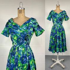 Vintage 1950's Green And Blue Floral Satin Fit And Flare Cocktail Party Dress Rockabilly Housewife Excellent Vintage Condition- Appears To Be Custom Handmade Green And Blue Abstract Floral Satin- Feels Like Acetate Gathered Portrait Collar With Short Sleeves And Cabbage Rose Applique Gathered Waist With Sweeping Skirt Heavy Duty Talon Brand Metal Zip And 2 Hook And Eye Closure Partially Lined Fits Modern 6 Measurements In Inches: Bust: 34" Waist: 25" Hips: 46" Length: 42" Mannaequin Measures 34" Floral Portrait, Rose Applique, Cabbage Rose, Womens Vintage Dresses, Rockabilly Dress, Cocktail Party Dress, 50s Fashion, Size 6 Dress, Blue Satin