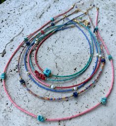 Whole sale 6 pieces daily boho necklace.Made from afghan heishi beads,turquoise and coral chipstone,freshwater pearl,hematite spacer beads.Finished gold plated clasp &extender chain. Necklace lenght 1-pink long: 24 inches +1'' extender chain 2-colorful  : 20.5 inches+1'' extender chain 3-navyblue&pearl: 15 inches+1''extender chain 4-green-red-pink-turquois&pearl: 15.75 inches+1''extender chain 5-turquoise+coral: 15 inches+1''extender chain 6-blue-green-red: 16 inches+1''extender chain Bohemian Necklaces With Heart And Heishi Beads, Bohemian Heishi Bead Necklace As A Gift, Heishi Beads Necklaces With Spacer Beads For Festivals, Festival Heishi Bead Necklaces With Spacer Beads, Gift Heishi Beaded Necklace With Natural Stones, Heishi Beads Necklace With Natural Stones For Gifting, Festival Jewelry With Heart And Heishi Beads, Bohemian Turquoise Necklace With Colorful Heishi Beads, Bohemian Heishi Beads Turquoise Necklace Gift